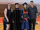 Morgan, her parents, and Scott at Morgan's graduation, May 2023
